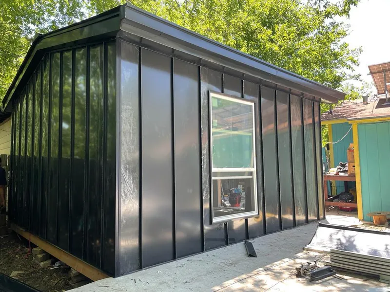 Black standing seam metal wall panels for Metal Roof Installation in Clarinda